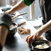 A woman is preparing food in a kitchen